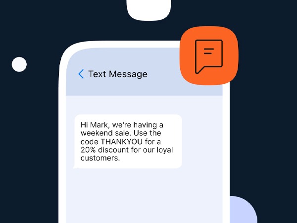 Phone showing a promotional SMS with a discount code.