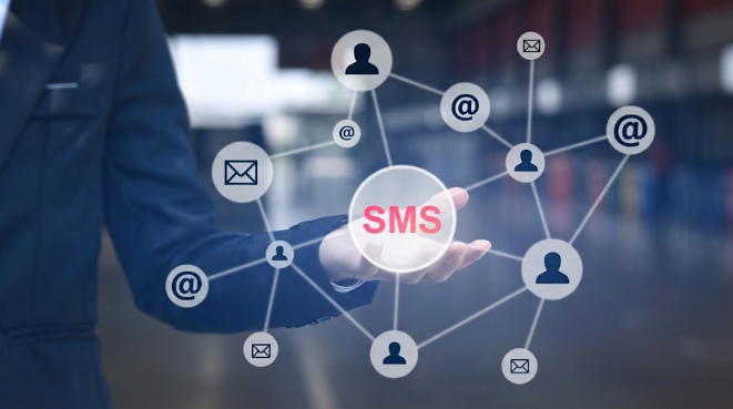 Business professional presenting an SMS network connecting users and messages.