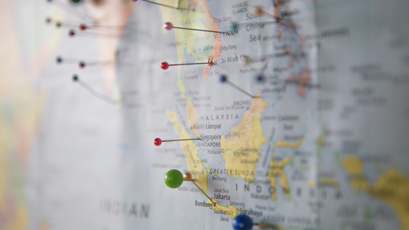 Push pins marking cities on a map of South-East Asia, including Kuala Lumpur, Singapore and Jakarta