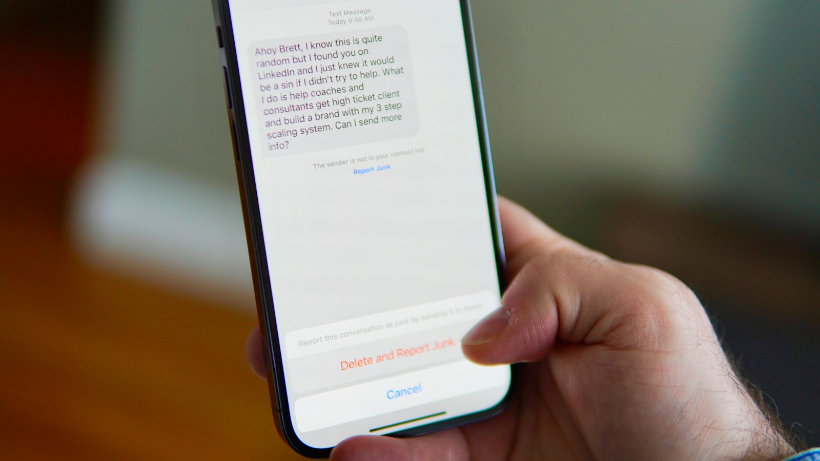 Smartphone displaying a text-message conversation for business sender ID communications