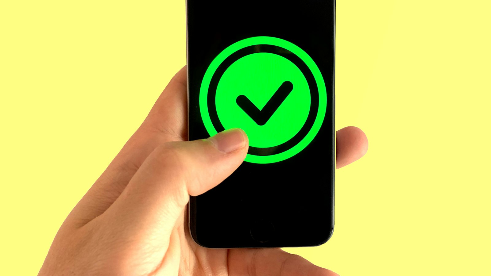 Smartphone showing a mobile app for sender ID registration and approval