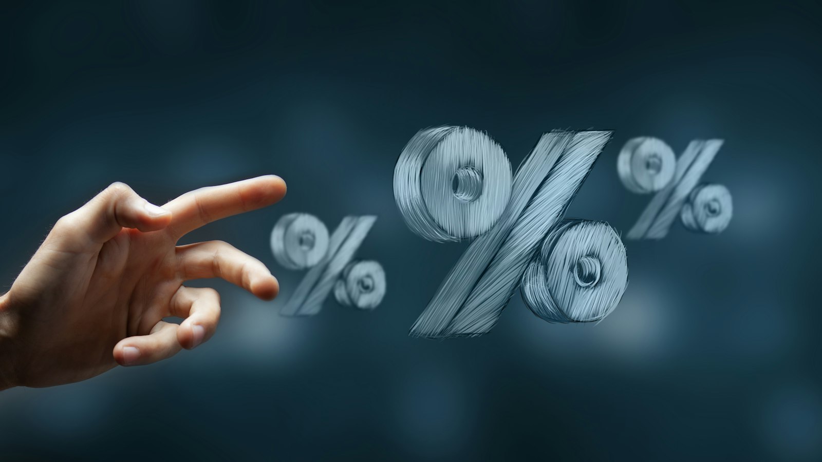 A hand reaching toward floating percentage signs