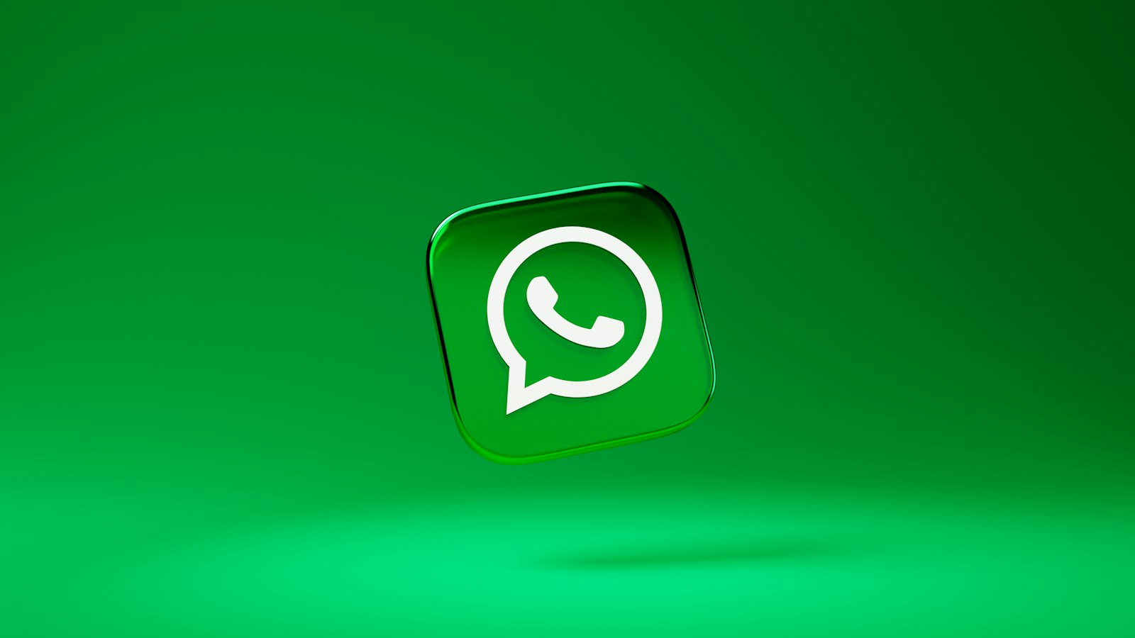 A green WhatsApp app icon on a matching background